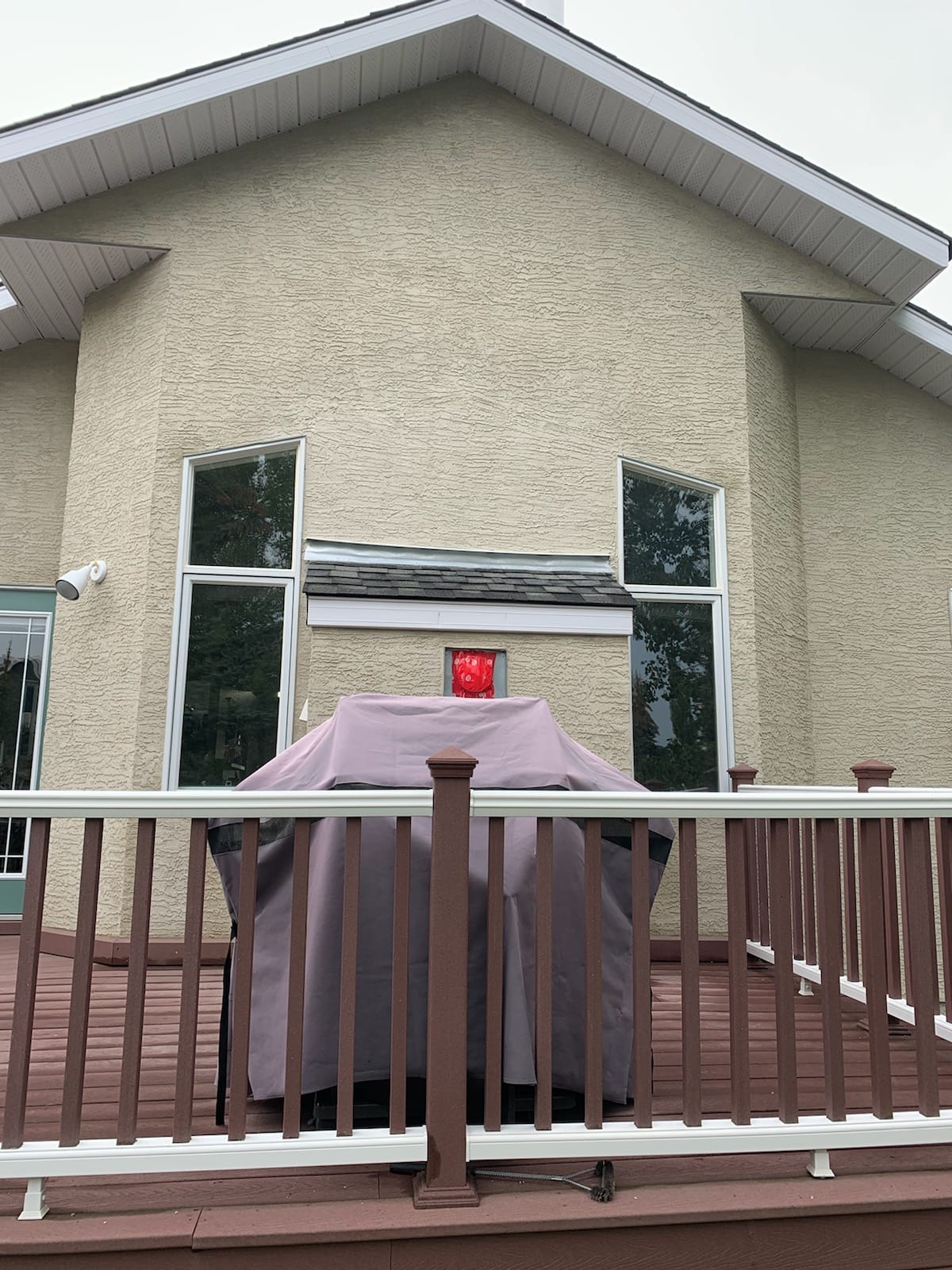 Partial stucco repair between windows