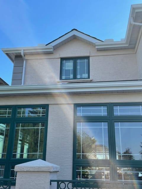 Light pink conventional textured stucco finish